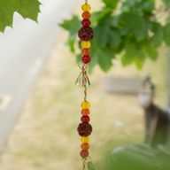Indické zvončeky - mosadzový Kvet Života so Rudraksha korálkami na šnúre - 6×63 cm